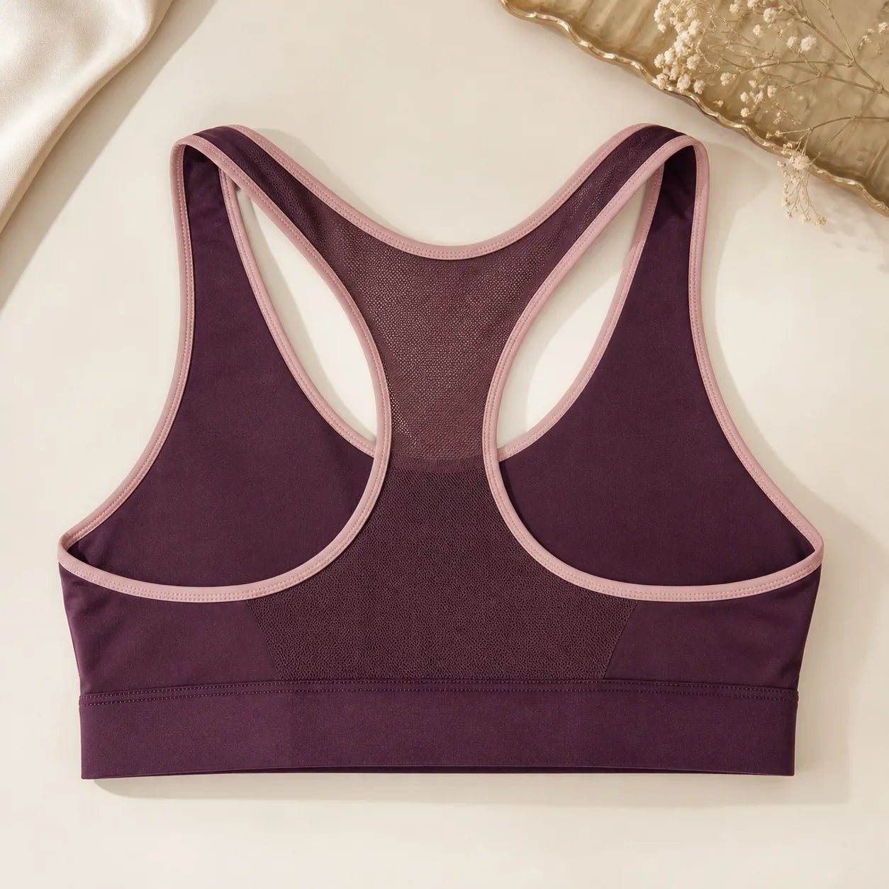 VELOURA FlexMove Sports Bra racerback flat lay — temporary concept image